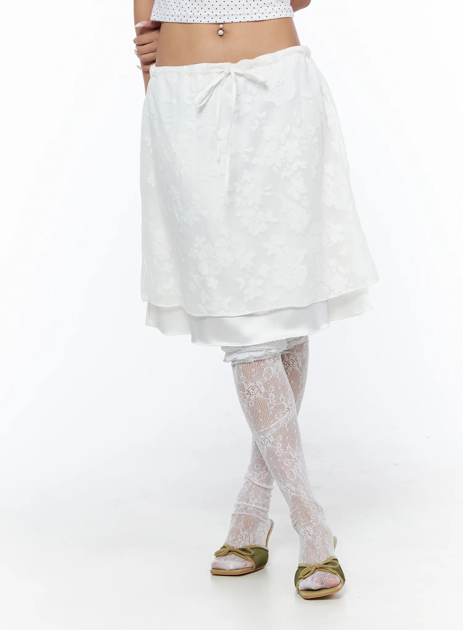 Floral Midi Skirt CU523 White front shot on model showing floral jacquard A-line silhouette with center bow tie waist and layered satin hem