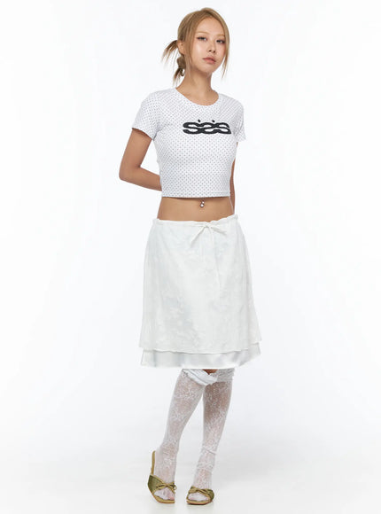 Floral Midi Skirt CU523 White full-length front shot on model in standing pose with polka-dot crop top showing bow tie waist and layered skirt hem