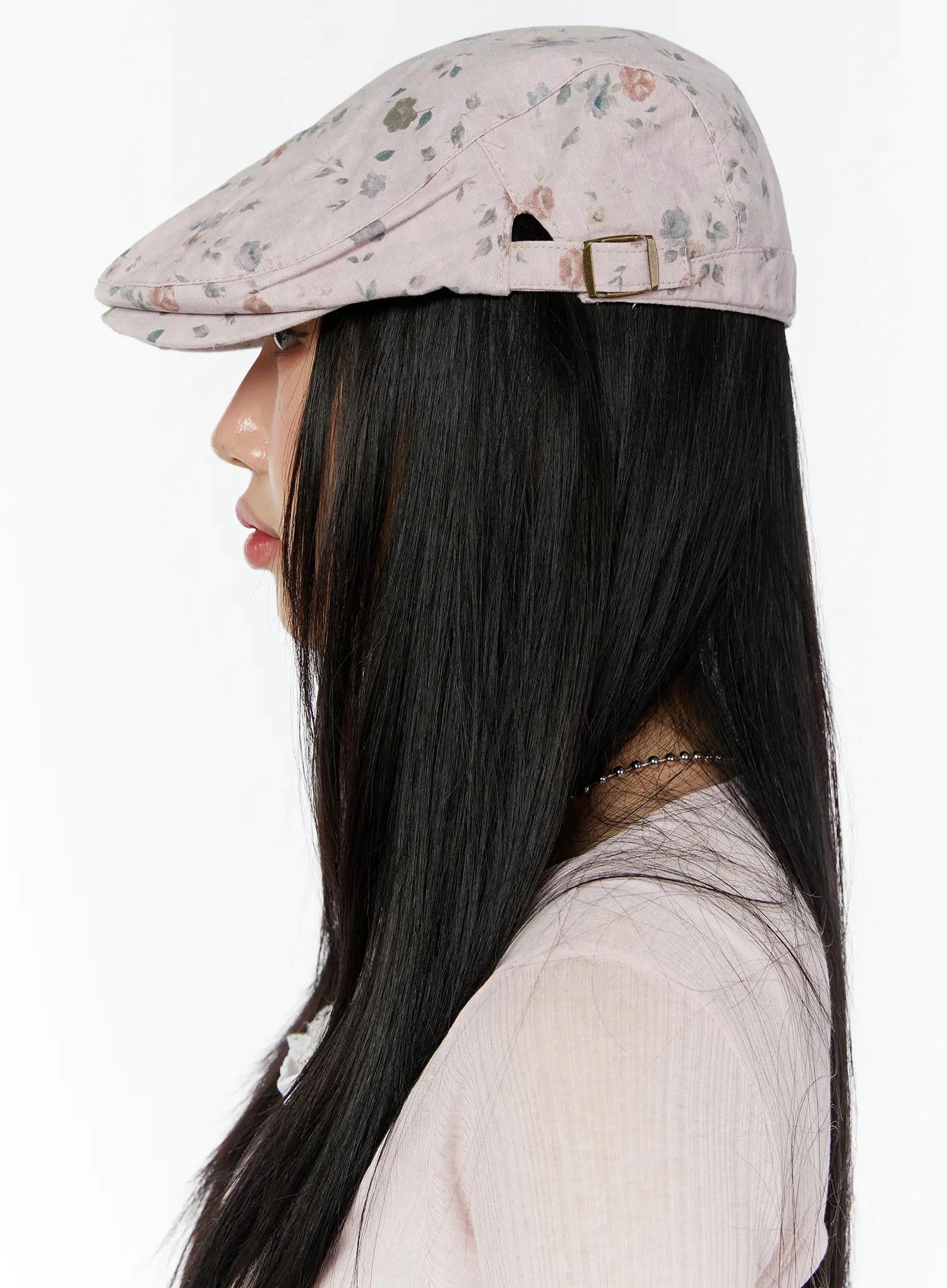 Floral Print Flat Cap IU524 Pink side profile model shot facing left, structured brim and gold back buckle strap clearly shown