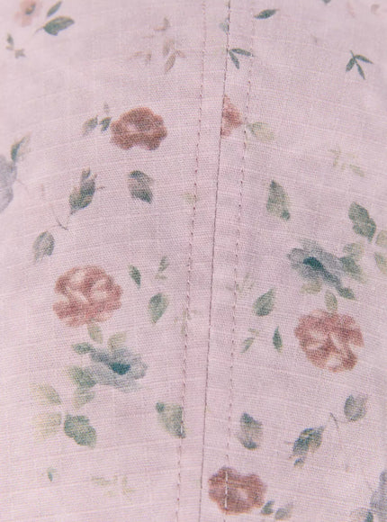 Floral Print Flat Cap IU524 Pink close-up detail shot of crown seam stitching and soft rose floral print fabric texture
