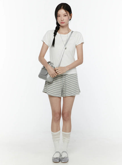 Floral Puff Short Sleeve Top IL506 White full-length front shot on model with white slouch socks and silver ballet flats holding silver bag