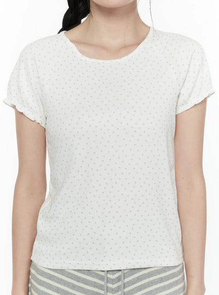 Floral Puff Short Sleeve Top IL506 White close-up front torso shot showing round neckline allover dot print and fitted silhouette with frill sleeve cuffs