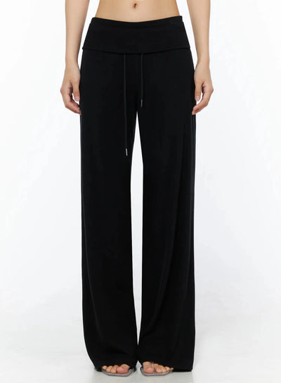 LEWKIN Fold-Over Drawstring Sweatpants IL509 Black front view on model size S/M cropped shot showing fold-over waistband and drawstring detail