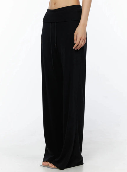 Fold-Over Drawstring Sweatpants IL509 Black side view on model showing fold-over waistband drawstring and wide-leg drape with clear heels