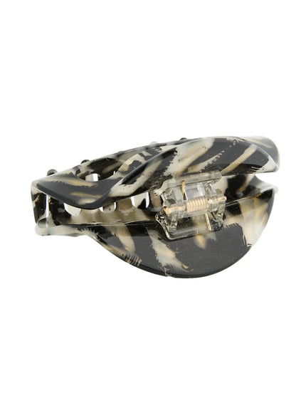 Freya Hair Clip IL503 black marble top-down close-up view displaying claws fully open flat showing spring hinge mechanism