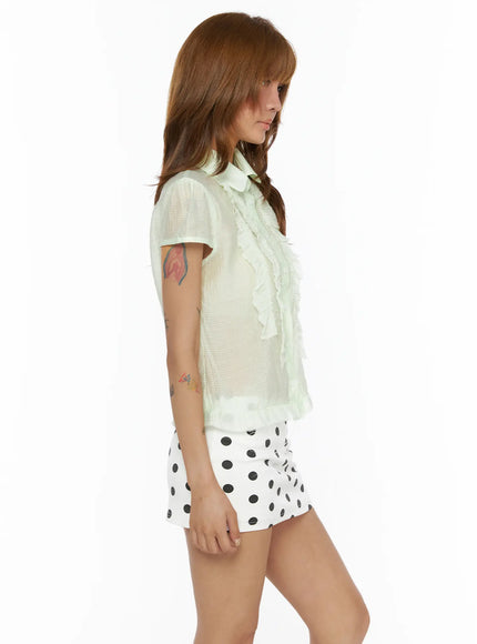 Frill Sheer Blouse CL503 Light green side close-up model shot, sheer fabric transparency and ruffle cascade detail highlighted, size S/M