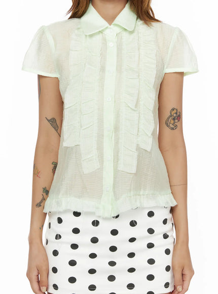 Frill Sheer Blouse CL503 Light green close-up front model shot, sheer grid-texture fabric with layered ruffle placket and white button detail, size S/M