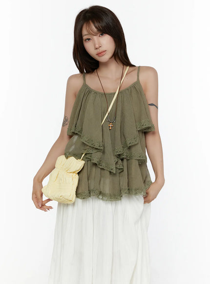 LEWKIN Frill Tiered Lace Sleeveless Top CL507 Dark green front shot on model styled with white maxi skirt and yellow crossbody bag