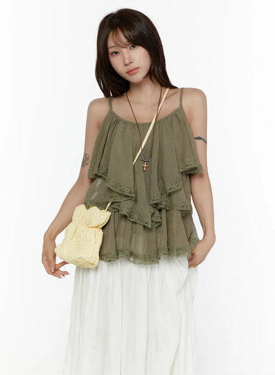 LEWKIN Frill Tiered Lace Sleeveless Top CL507 Dark green front shot on model styled with white maxi skirt and yellow crossbody bag