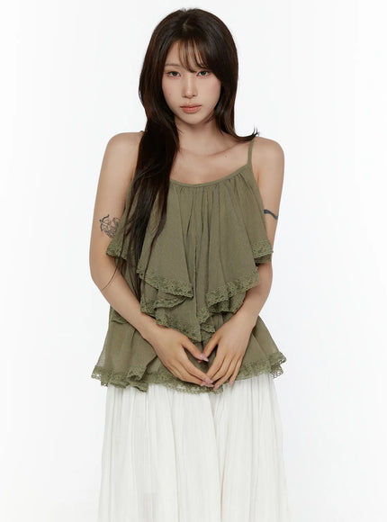 Frill Tiered Lace Sleeveless Top CL507 Dark green close-up front shot on model showing tiered ruffle layers with floral lace trim detail