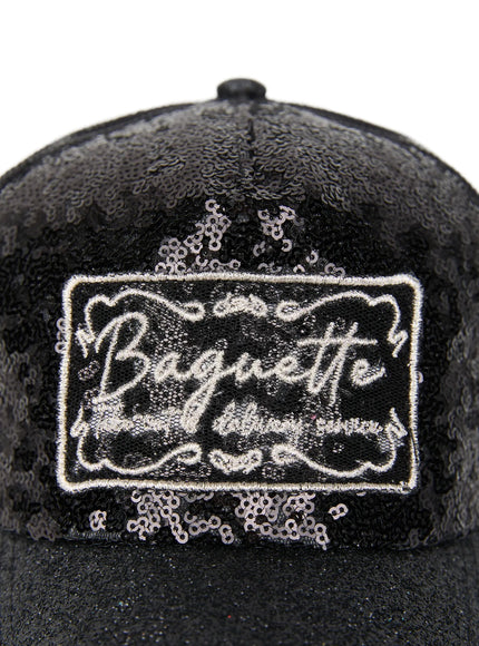 Glitter Patch Trucker Cap IL509 Black front product shot no model showing full black sequin crown Baguette patch black mesh back and glitter brim