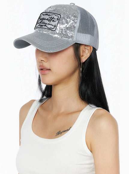 Glitter Patch Trucker Cap IL509 Silver side view on model showing sequin front panel glitter brim and mesh back with hoop earring detail