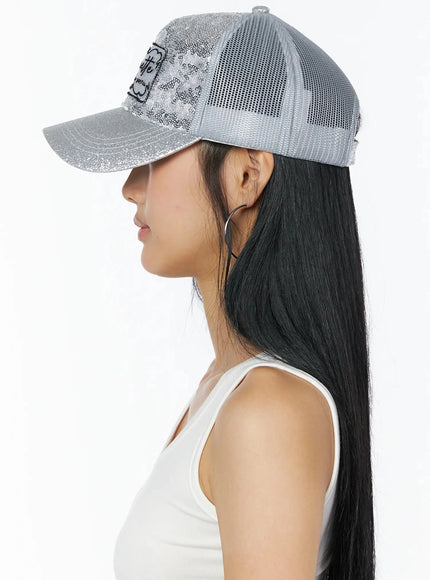 Glitter Patch Trucker Cap IL509 Silver back view on model showing grey mesh panels snap closure and glitter strap styled with white tank top