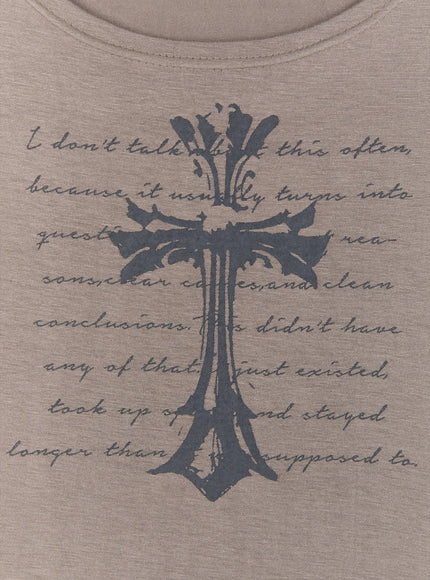 Gothic Cross Slim Fit Top IU525 grey-brown close-up flat detail shot, dark navy gothic cross and cursive script print on taupe fabric, scoop neckline texture visible