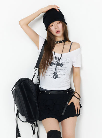 LEWKIN Gothic Cross Slim Fit Top IU525 White S/M front model shot with off-shoulder styling, black beanie, gothic cross print, paired with black cargo shorts