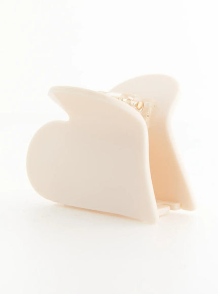 Grace Heart Hair Clip IL503 Cream front angle detail showing open claw wings and gold-tone spring hinge mechanism