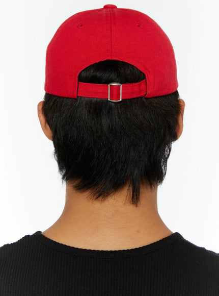 Graphic Baseball Cap IL515 Red full-body side model shot styled with black studded tank and gray washed denim shorts, walking pose