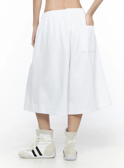 Graphic Bermuda Shorts CL524 White back view on model showing clean plain back panel with patch pocket and elastic ruched waistband
