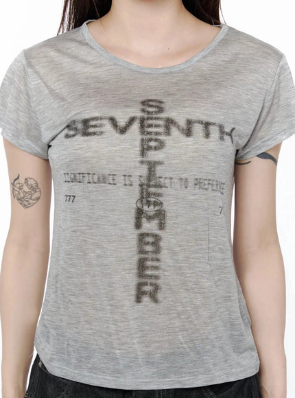 Graphic Casual Tee IL502 Gray close-up front detail shot on model showing cross-shaped SEVENTH SEPTEMBER graphic print on semi-sheer marled fabric