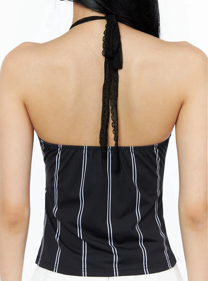 Graphic Lace Halter Top IL509 Black back close-up detail showing open back lace halter tie strap and white vertical pinstripe pattern on black knit fabric