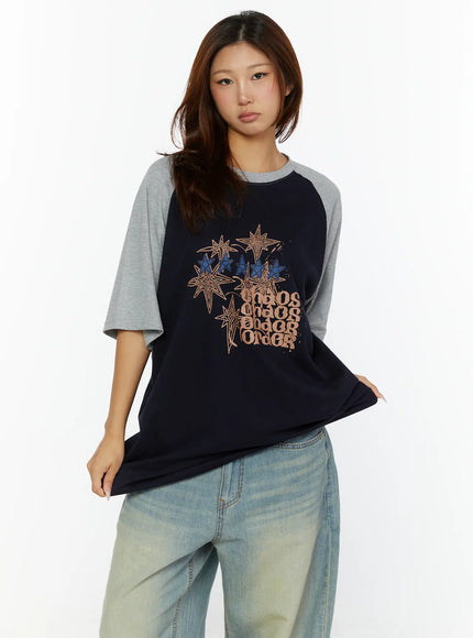Graphic Oversided Tee CL515 Navy front view on model showing navy body with grey raglan sleeves and star chaos order graphic print on chest