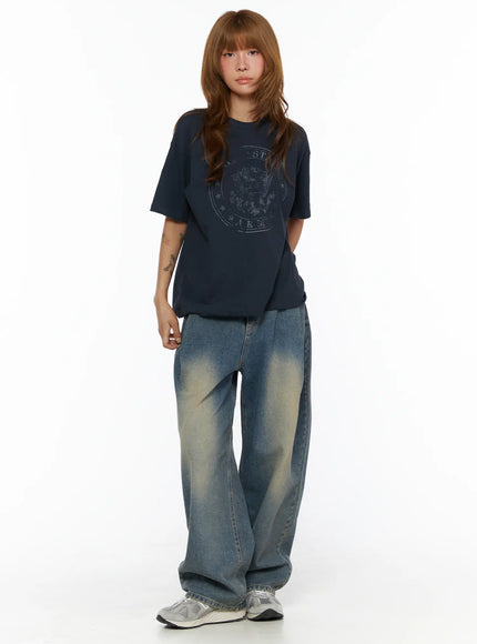 Graphic Oversized Tee CL503 Dark blue front full-body shot on model standing with arms down, styled with faded wide-leg jeans and sneakers