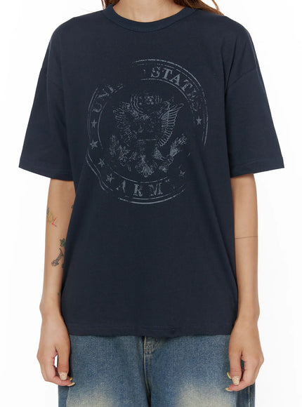 Graphic Oversized Tee CL503 Dark blue close-up front detail shot on model highlighting distressed United States Army eagle seal circular graphic print