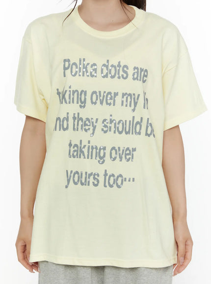 Graphic Oversized Tee CL508 Yellow close-up front detail on model showing polka dot-textured gray typography print on soft cotton fabric