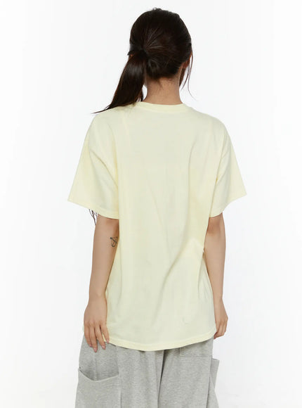 Graphic Oversized Tee CL508 Yellow back view on model with ponytail showing clean plain back, relaxed dropped shoulder and curved hem