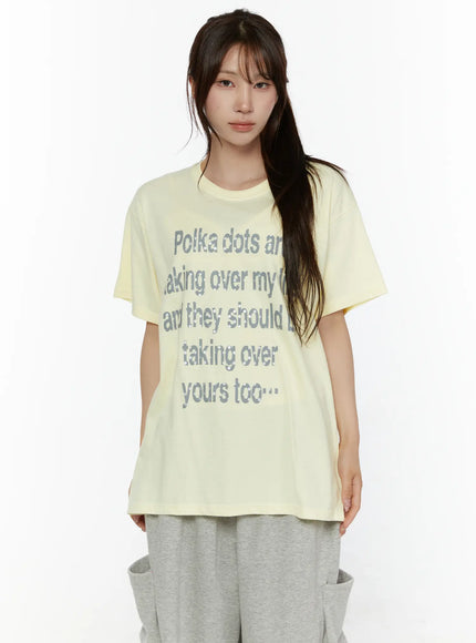 LEWKIN Graphic Oversized Tee CL508 Yellow front view on model wearing gray sweatpants, short-sleeve cotton tee with gray polka dot letter print
