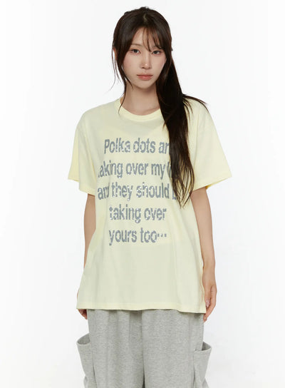 LEWKIN Graphic Oversized Tee CL508 Yellow front view on model wearing gray sweatpants, short-sleeve cotton tee with gray polka dot letter print