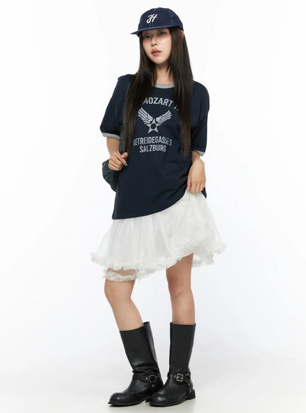 Graphic Oversized Tee CL517 Dark blue full-body front view on model with cap and bag, navy tee with gray trim, tulle skirt and black biker boots styled outfit