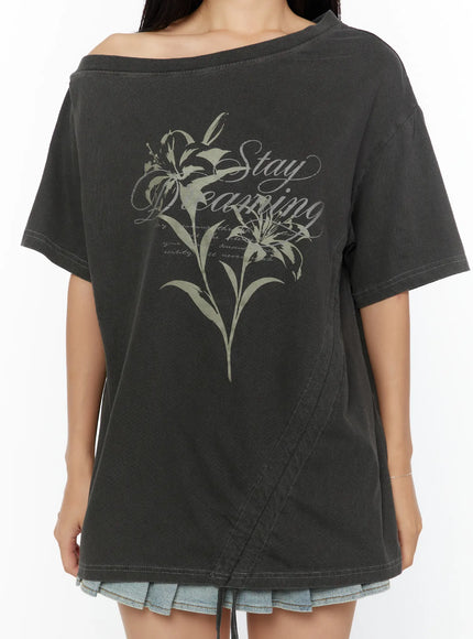 Graphic Print One-Shoulder Oversized Tee CU529 dark gray close-up front model shot with drawstring relaxed showing full lily Stay Dreaming script graphic and neckline