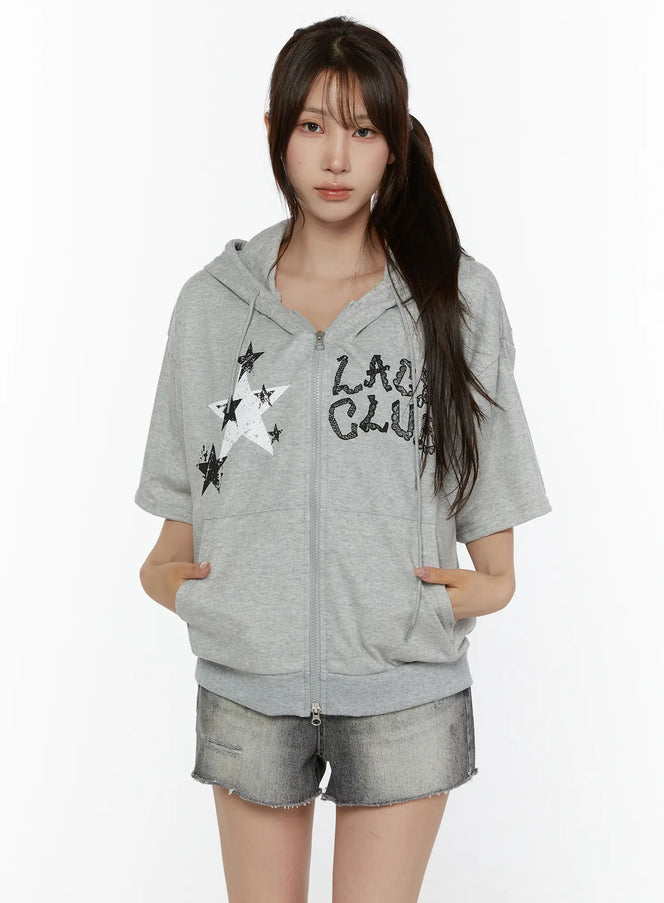 LEWKIN Graphic Print Short Sleeve Hooded Zip-Up CL507 Gray front view on model wearing denim shorts hands in pockets star and letter print