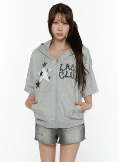 LEWKIN Graphic Print Short Sleeve Hooded Zip-Up CL507 Gray front view on model wearing denim shorts hands in pockets star and letter print