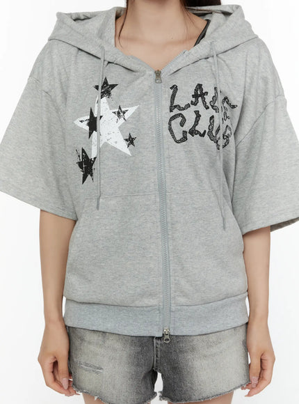 Graphic Print Short Sleeve Hooded Zip-Up CL507 Gray close-up front detail showing star graphic and Lady Club letter print zip closure and hood drawstring
