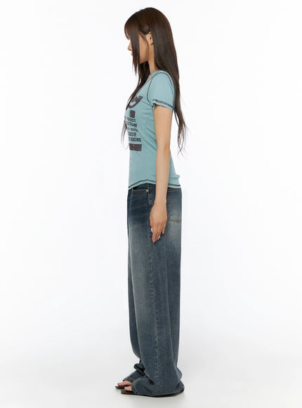 Graphic Print V-Neck Tee IL523 Light blue side model shot showing slim fitted silhouette short sleeves and contrast stitching