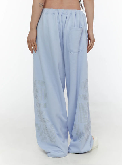 Graphic Print Wide Sweatpants CL507 light blue back shot on model showing back pocket elastic waistband and large star graphic print on both legs