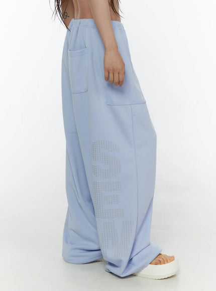 Graphic Print Wide Sweatpants CL507 light blue side shot on model showing wide-leg silhouette elastic waist side pocket and star graphic print