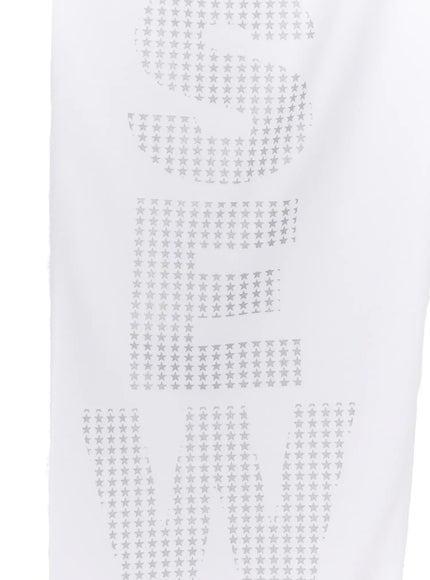Graphic Print Wide Sweatpants CL507 white close-up flat detail of large vertical silver star-pattern letter graphic print on leg