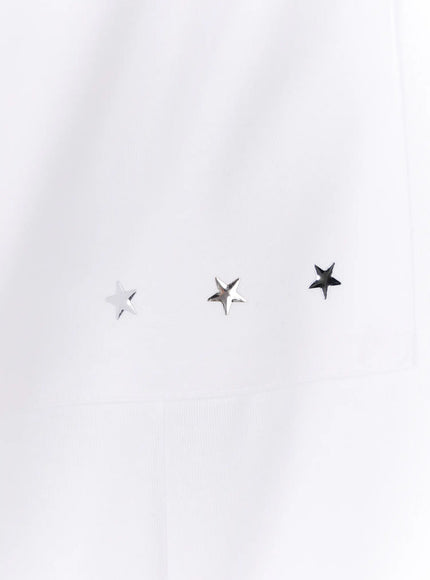 Graphic Print Wide Sweatpants CL507 white close-up detail of three silver metal star studs on pocket fabric texture visible