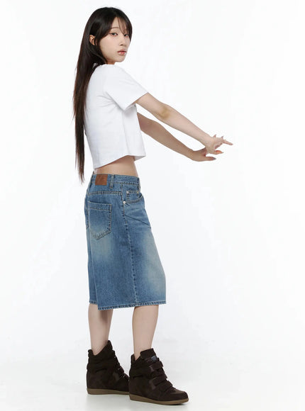 Graphic Rabbit Crop Top IL502 White side shot on model with arms extended showing back panel, cropped hem, and rear denim pocket detail