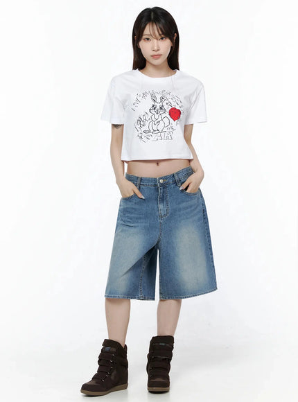 Graphic Rabbit Crop Top IL502 White full-body front shot on model hands in pockets styled with wide-leg denim shorts and wedge sneakers