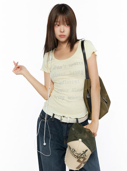 LEWKIN Graphic Scoop Neck Top IL523 Yellow front shot on model styled with jeans, bag, and earphones, rhinestone gothic letter print, flutter sleeves, S/M