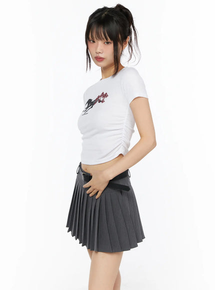 Graphic Shirred Crop Tee CU530 White back view on model showing plain white ribbed short-sleeve crop back styled with gray pleated mini skirt and black belt