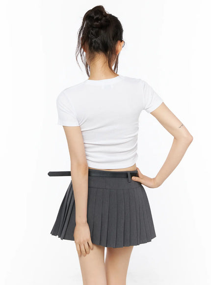Graphic Shirred Crop Tee CU530 White back full-body view on model hand on hip revealing clean back construction ruched sides and crop hem above waistband