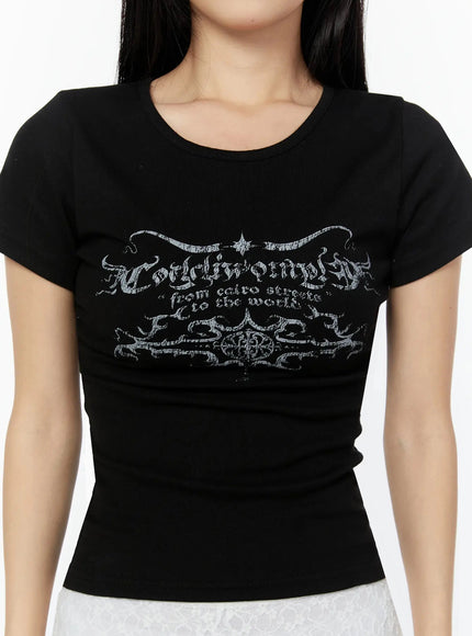 Graphic Short Sleeve Tee IU524 Black close-up detail of gothic calligraphy and ornamental chest print on ribbed cotton fabric