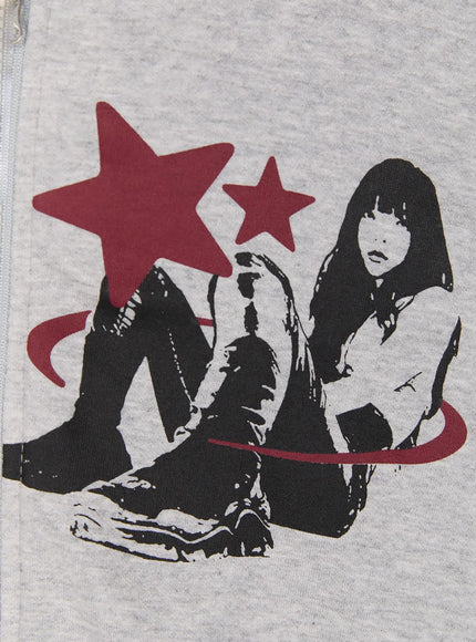 Graphic Short Sleeve Zip-Up Hoodie IU525 Gray close-up detail of right chest graphic, seated figure with red stars and swirl motif on heathered gray cotton fabric