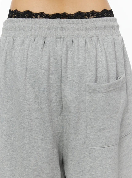 Graphic Sweatpants IL509 Gray close-up detail of back waistband showing gathered elastic band lace bralette peeking above and back patch pocket construction