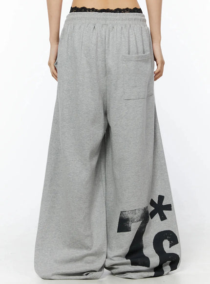 Graphic Sweatpants IL509 Gray back model shot showing large brushstroke 7*6 graphic on lower back legs elastic gathered waistband and back patch pocket